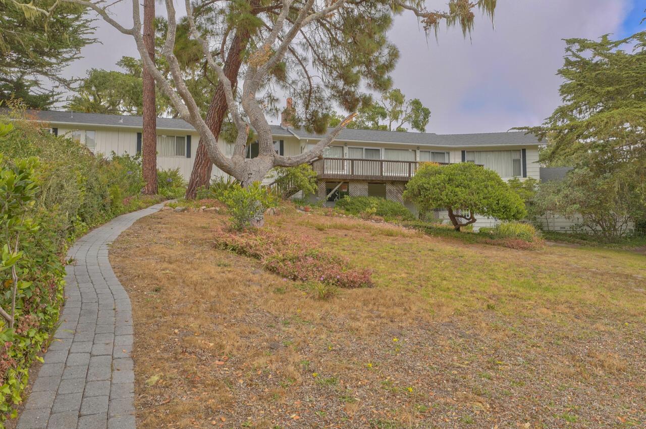 3245 Cabrillo Road Pebble Beach, CA 93953 - Photo 53 of 59 a front view of a house with a yard