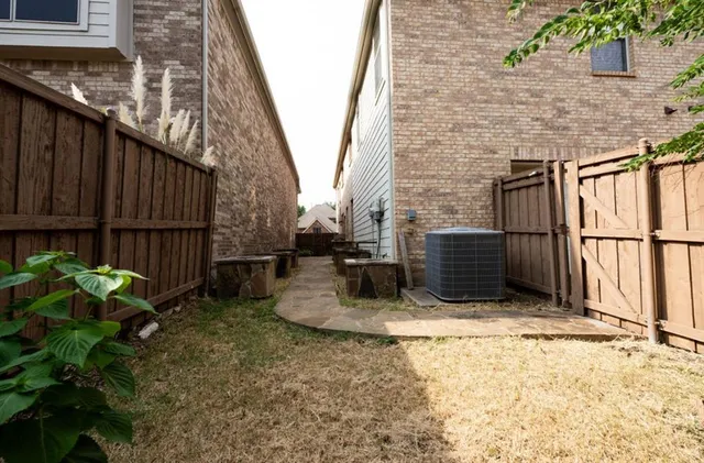 a view of a backyard with sitting area