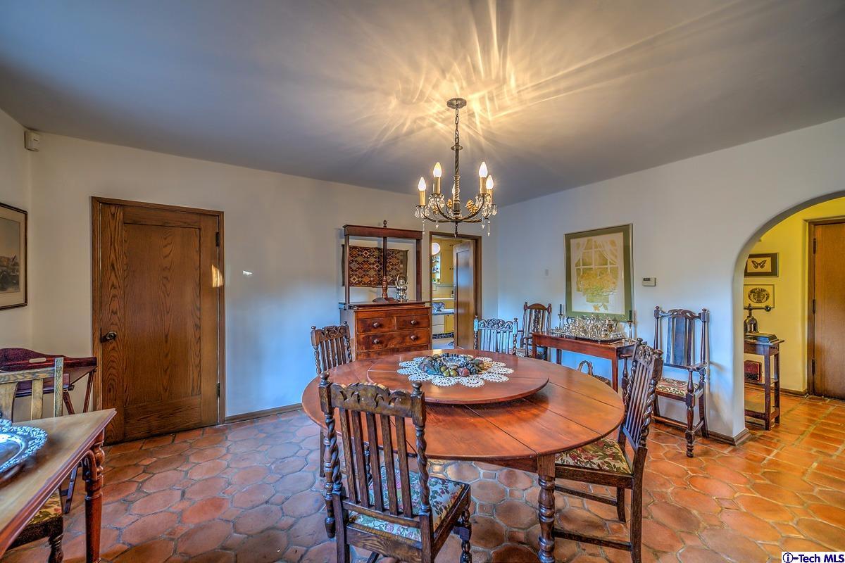 1271 Roanoke Road San Marino, CA 91108 - Photo 21 of 65 a view of a dining room with furniture a chandelier and wooden floor