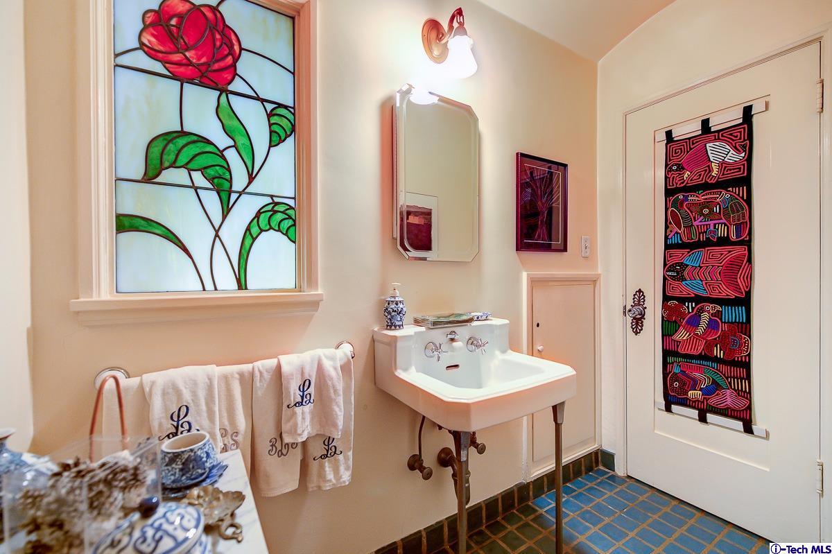 1271 Roanoke Road San Marino, CA 91108 - Photo 27 of 65 a white bath tub sitting next to a bathroom sink