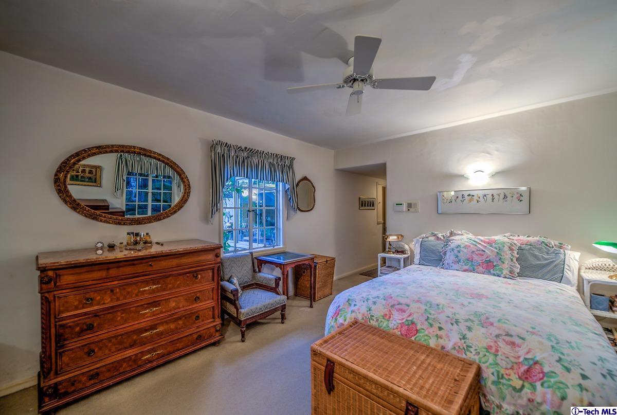 1271 Roanoke Road San Marino, CA 91108 - Photo 35 of 65 a bedroom with a bed a dresser and painting on the wall