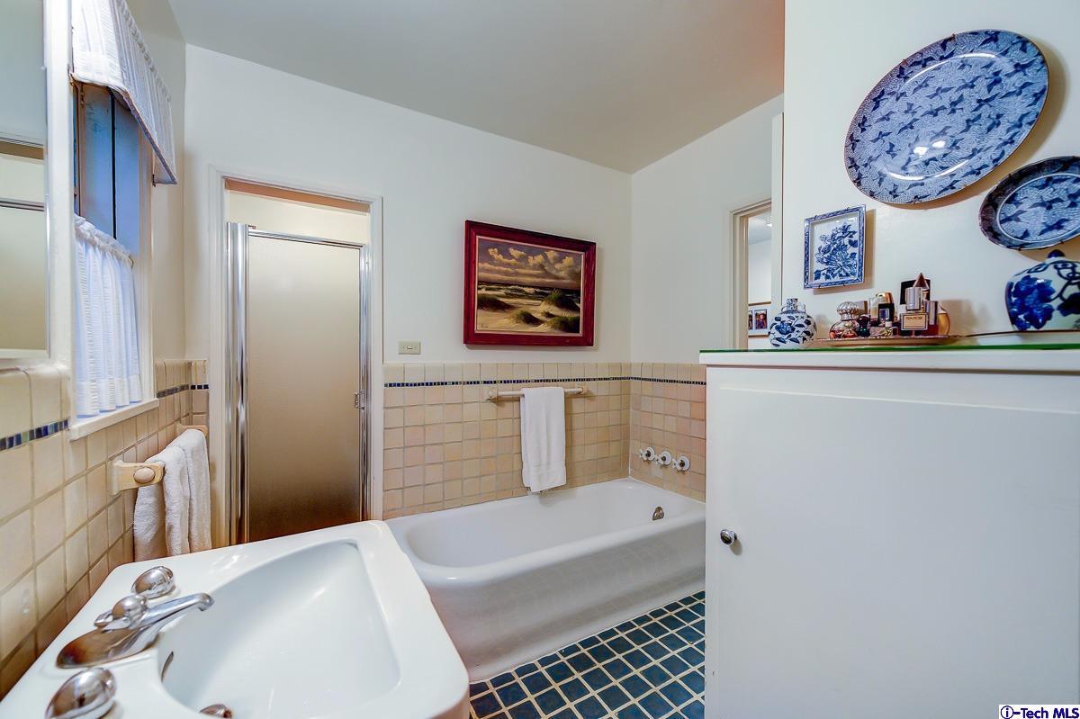 1271 Roanoke Road San Marino, CA 91108 - Photo 40 of 65 a bathroom with a sink and a mirror
