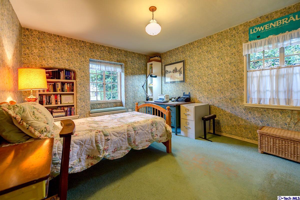 1271 Roanoke Road San Marino, CA 91108 - Photo 42 of 65 a bedroom with a bed chair and window