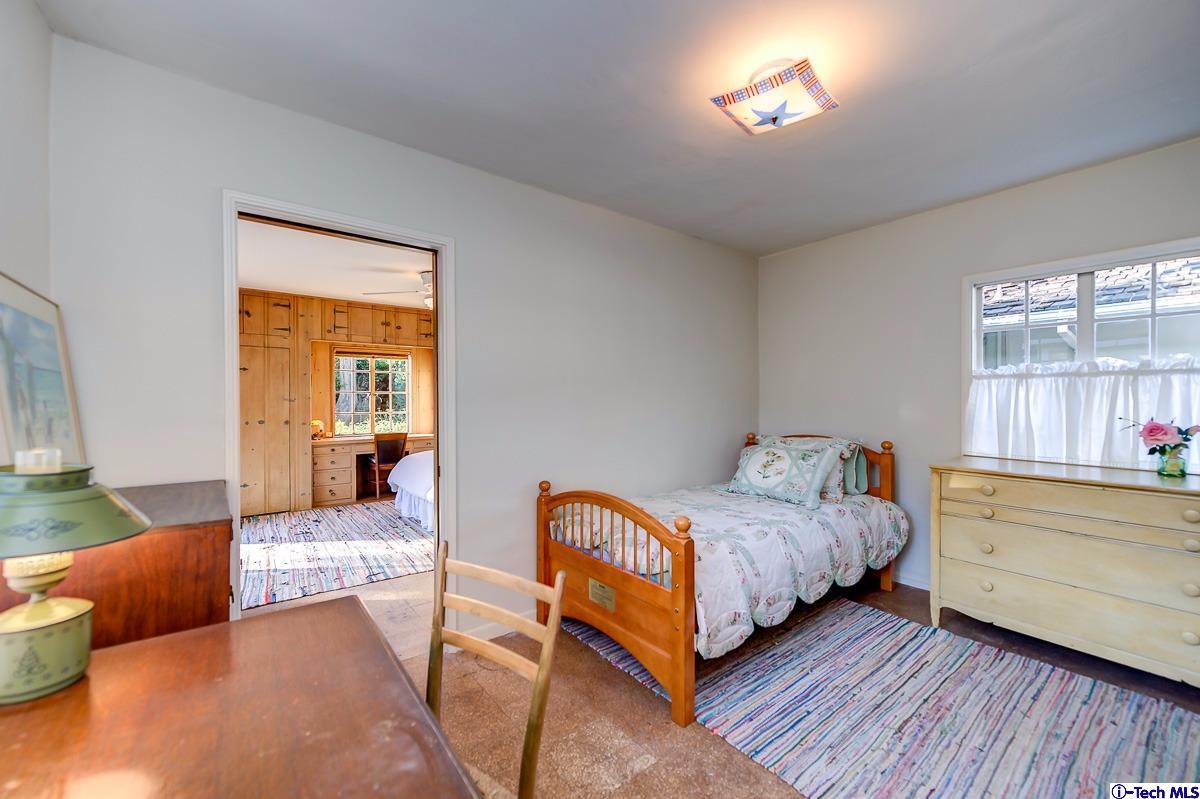 1271 Roanoke Road San Marino, CA 91108 - Photo 47 of 65 a bedroom with a bed and a dresser next to a window