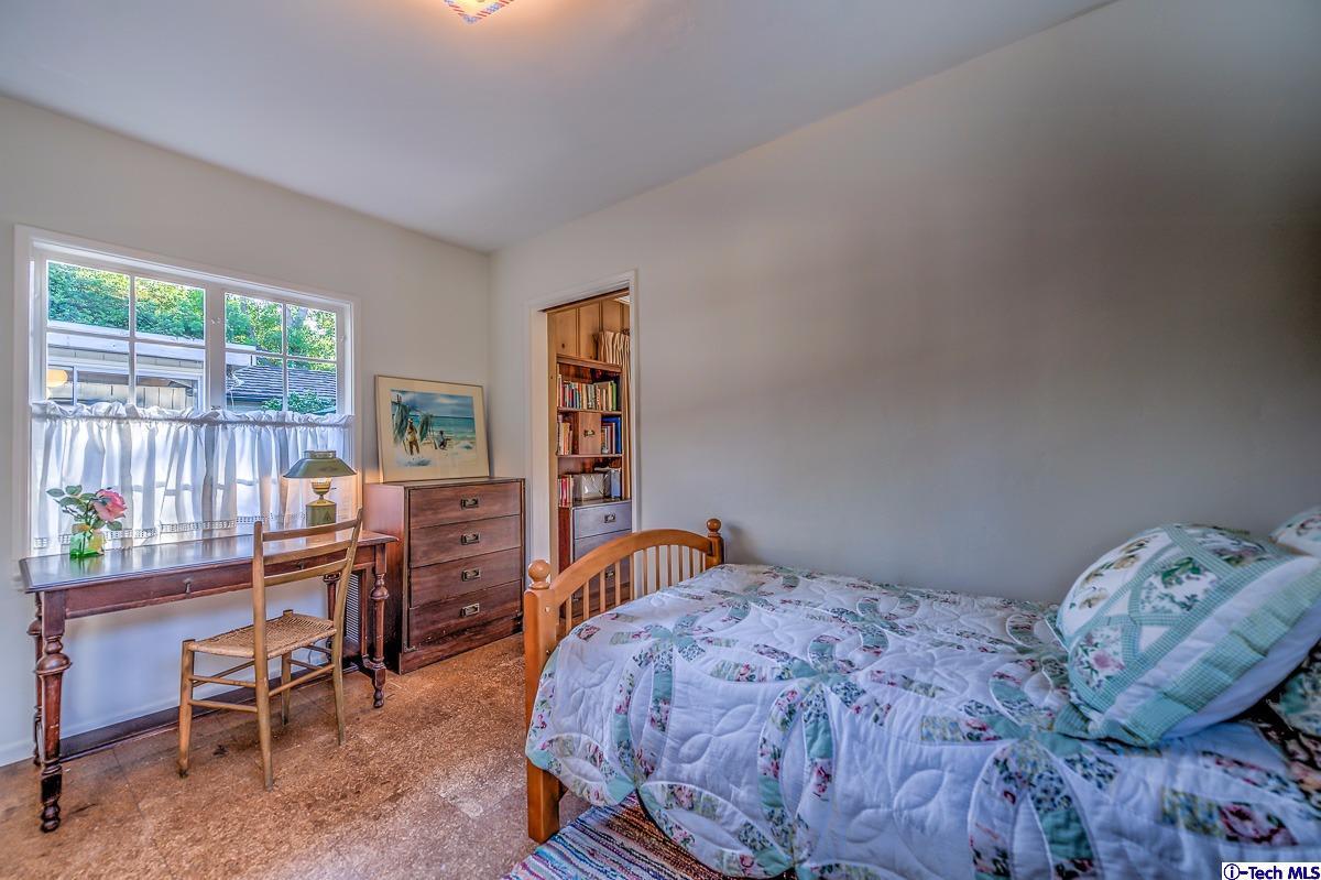 1271 Roanoke Road San Marino, CA 91108 - Photo 48 of 65 a bedroom with a bed and a desk