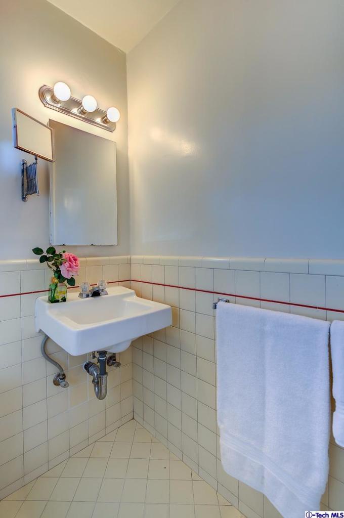 1271 Roanoke Road San Marino, CA 91108 - Photo 50 of 65 a bathroom with a sink and a mirror