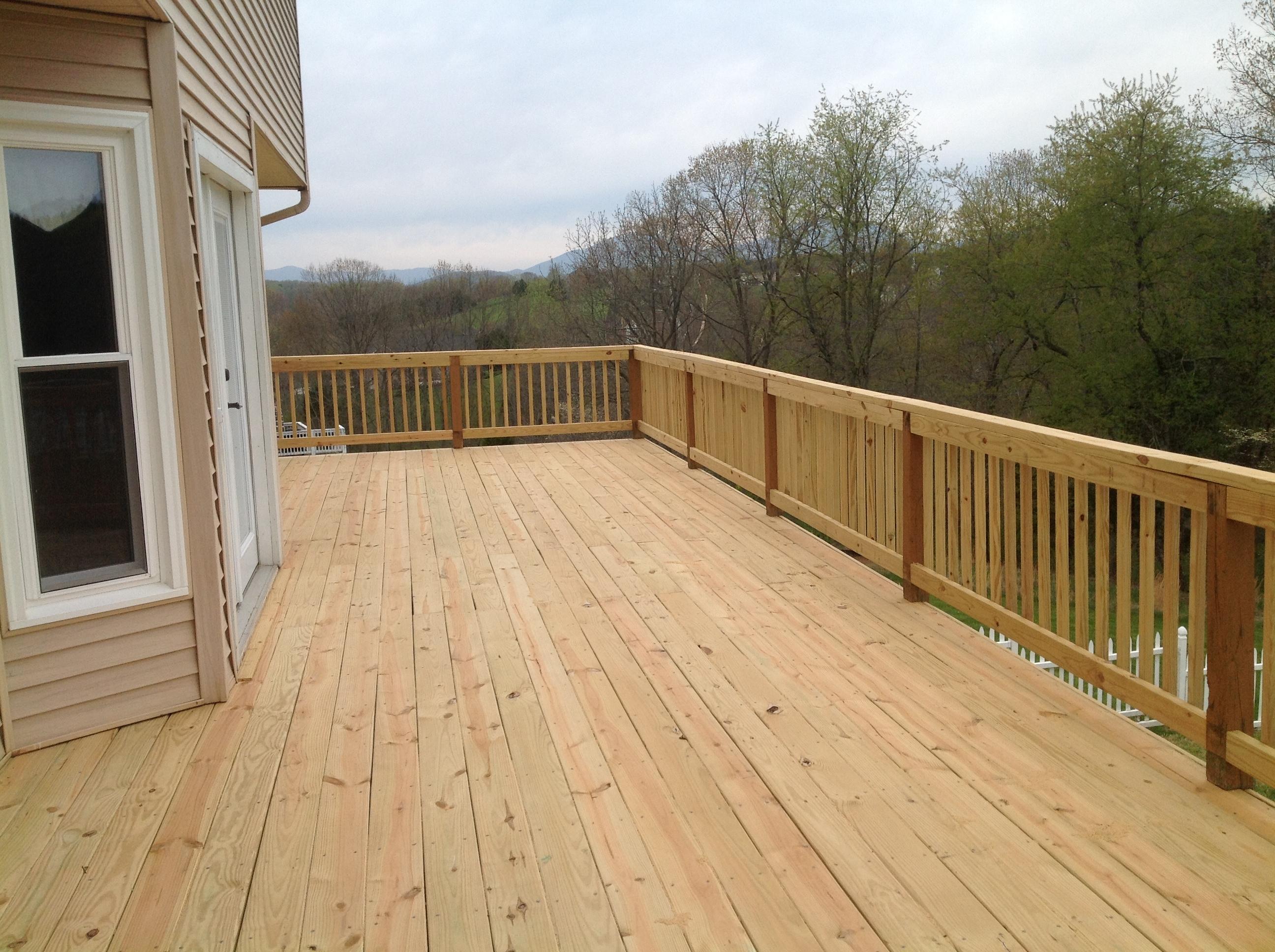 219 Longhill Road Goode, VA 24556 - Photo 8 of 15 a view of balcony with wooden floor and fence