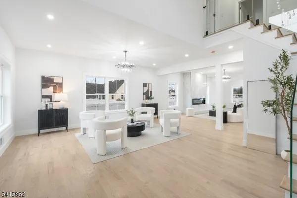 a view of a living room kitchen and a sink