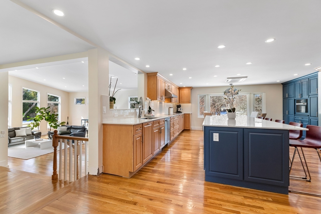 1 Maureen Road Lexington, MA 02420 - Photo 12 of 40 a view of kitchen with kitchen island stainless steel appliances refrigerator oven dining table and chairs
