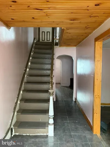 a view of a room with wooden floor and cabinet