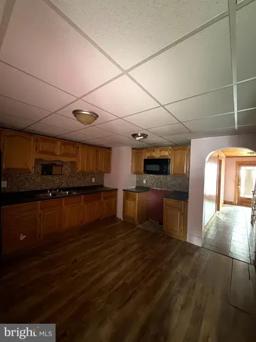 a bathroom with a toilet a sink and bathtub