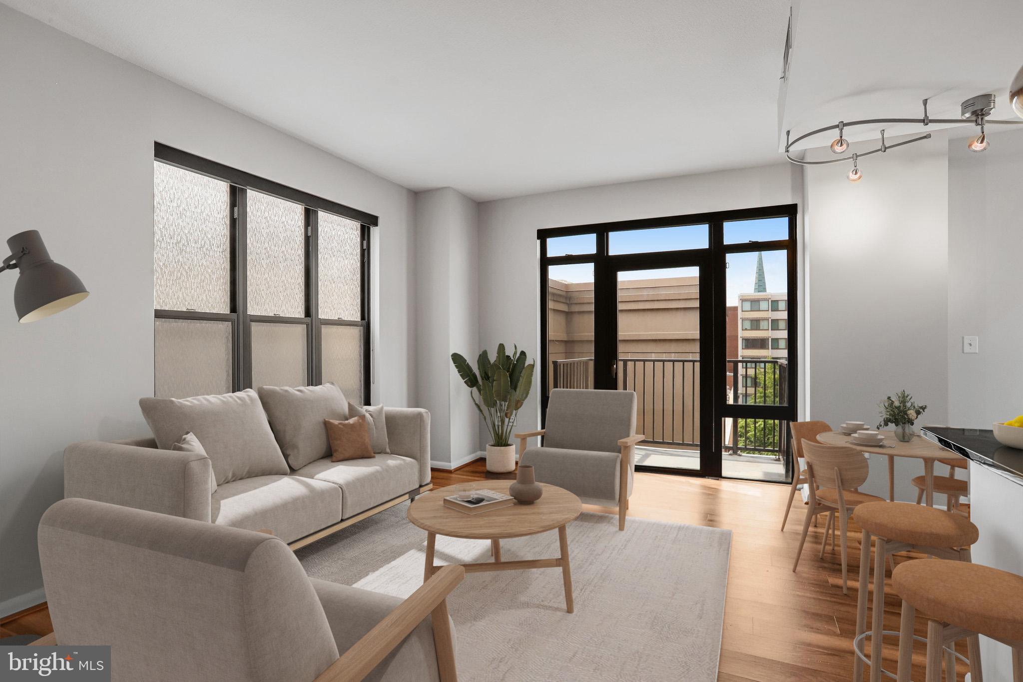 1001 L Street Northwest, Unit 811 Washington, DC 20001 - Photo 10 of 45 a living room with furniture and a large window
