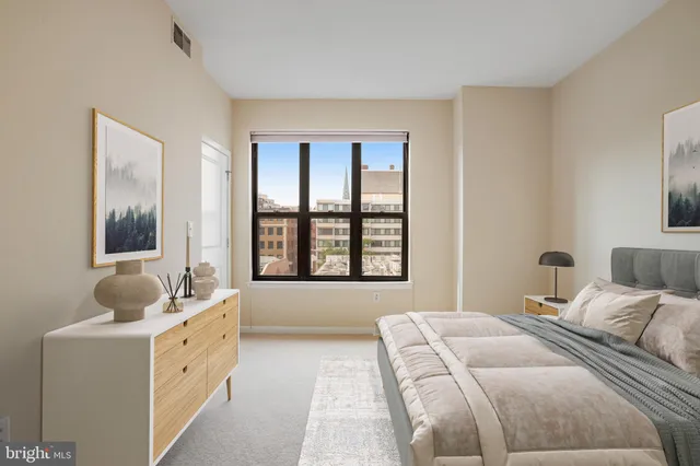 a large kitchen with cabinets wooden floor and stainless steel appliances