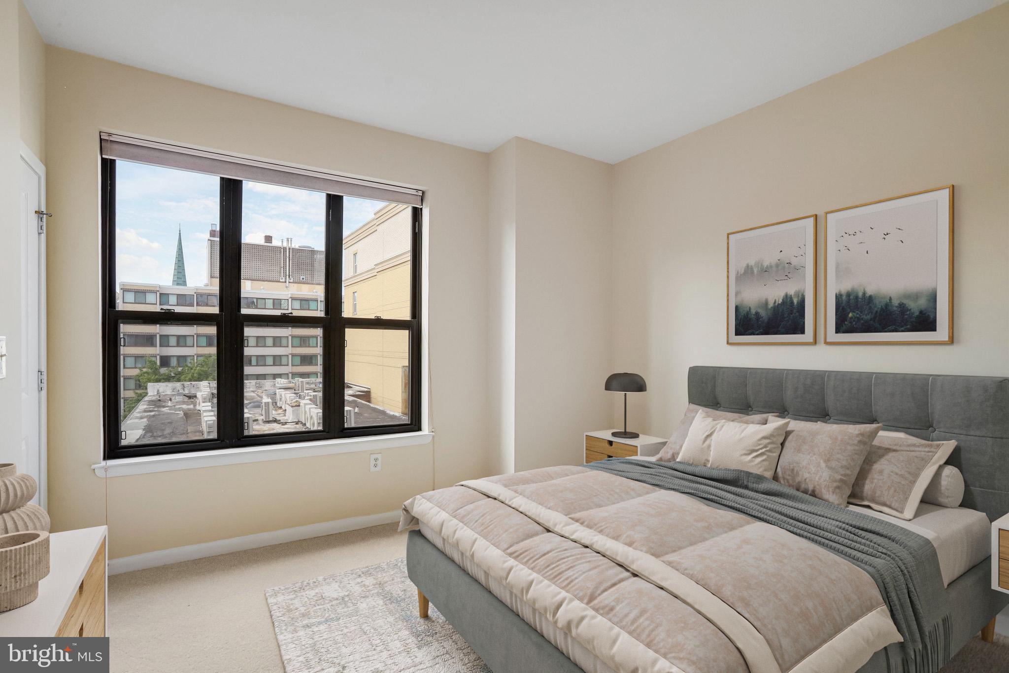 1001 L Street Northwest, Unit 811 Washington, DC 20001 - Photo 18 of 45 a bedroom with a bed and a window