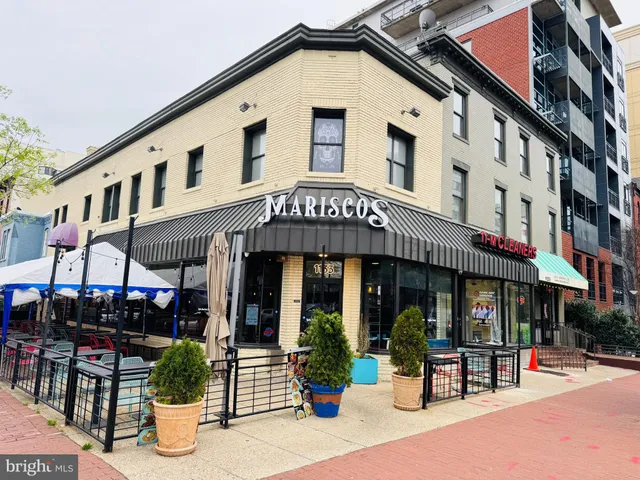 a view of a building with sitting area