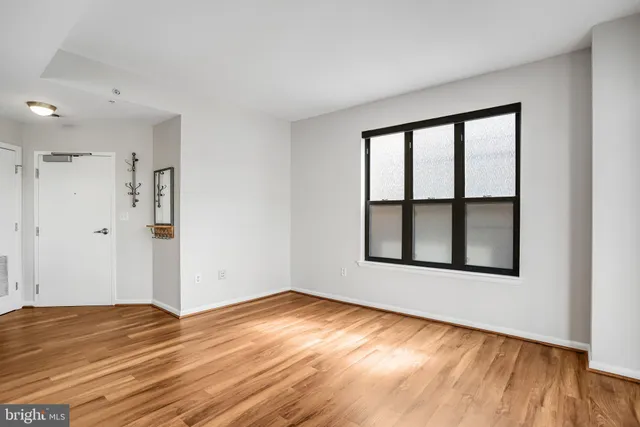 a kitchen with granite countertop a stove a sink and a chandelier
