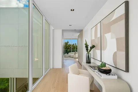 a spacious bathroom with a double vanity sink and a lake view