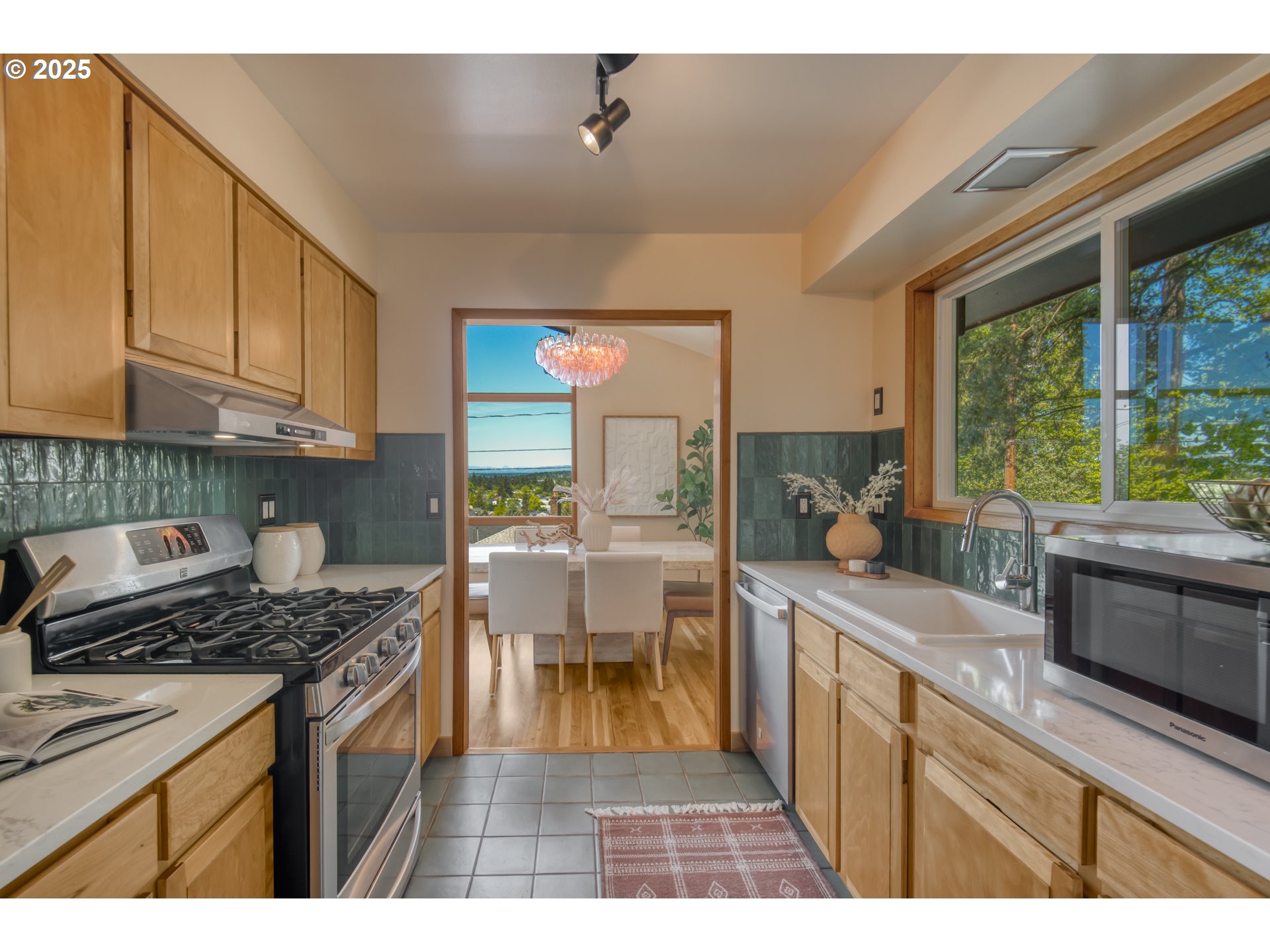 6950 Southeast Ash Street Portland, OR 97215 - Photo 11 of 45 a kitchen with a stove a sink and a cabinets