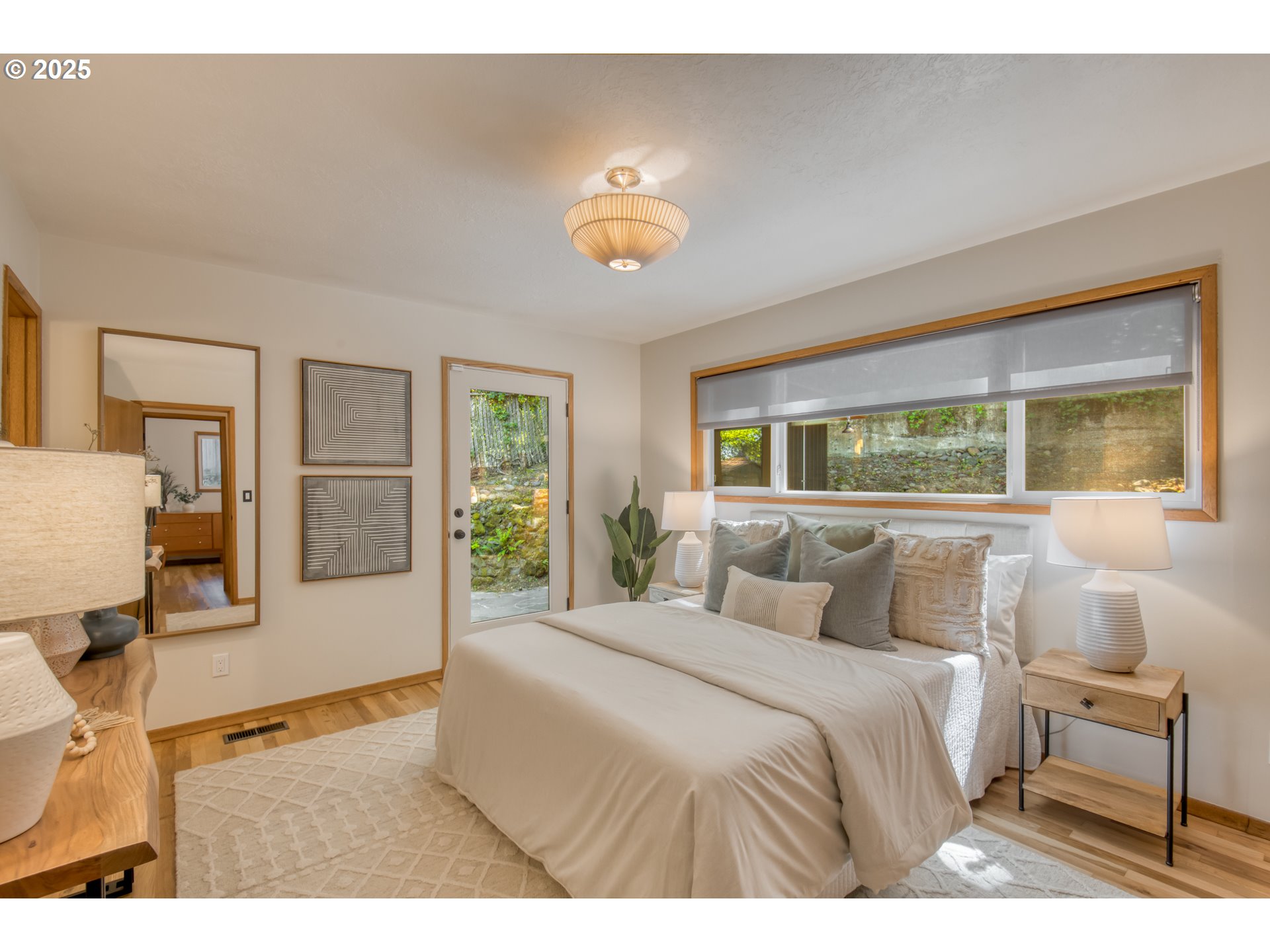 6950 Southeast Ash Street Portland, OR 97215 - Photo 14 of 45 a bedroom with a bed and window