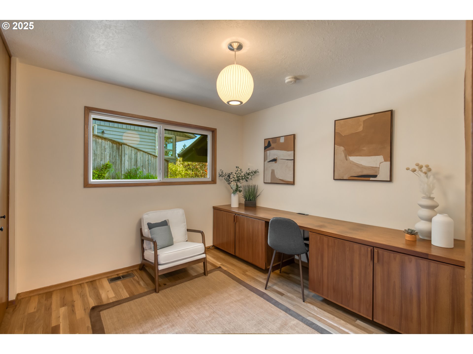 6950 Southeast Ash Street Portland, OR 97215 - Photo 19 of 45 a living room with furniture and a window