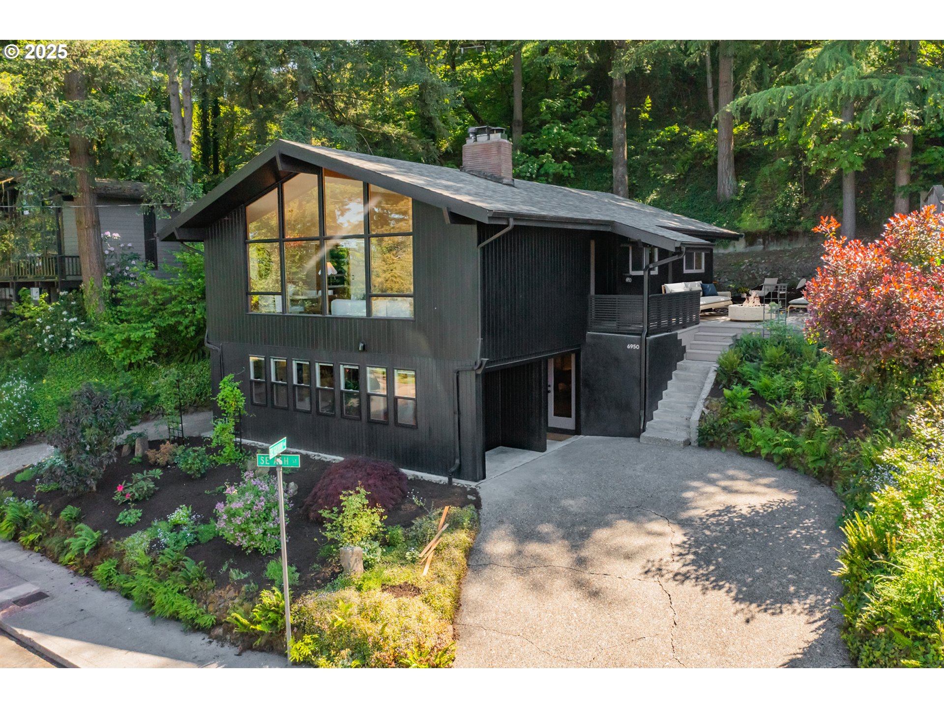 6950 Southeast Ash Street Portland, OR 97215 - Photo 2 of 45 a view of a house with a yard