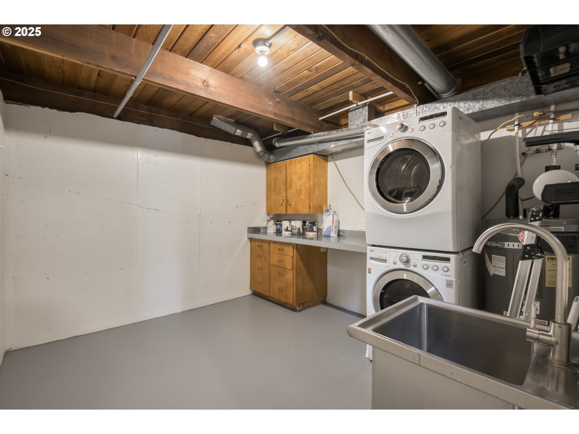 6950 Southeast Ash Street Portland, OR 97215 - Photo 21 of 45 a utility room with dryer and washer