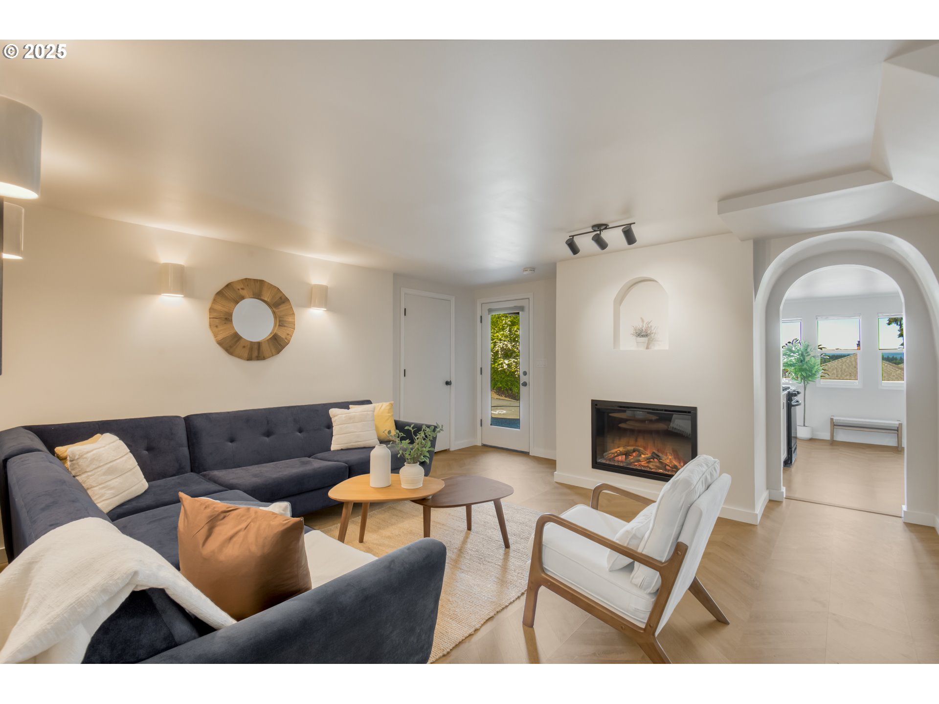 6950 Southeast Ash Street Portland, OR 97215 - Photo 22 of 45 a living room with furniture and a fireplace