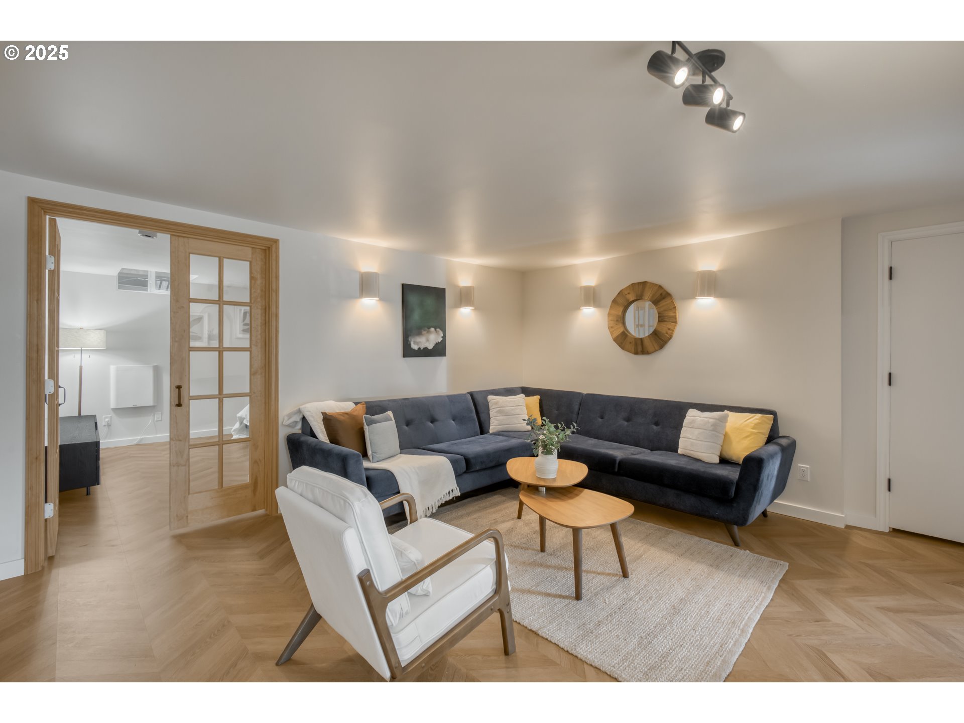 6950 Southeast Ash Street Portland, OR 97215 - Photo 24 of 45 a living room with furniture and a wooden floor