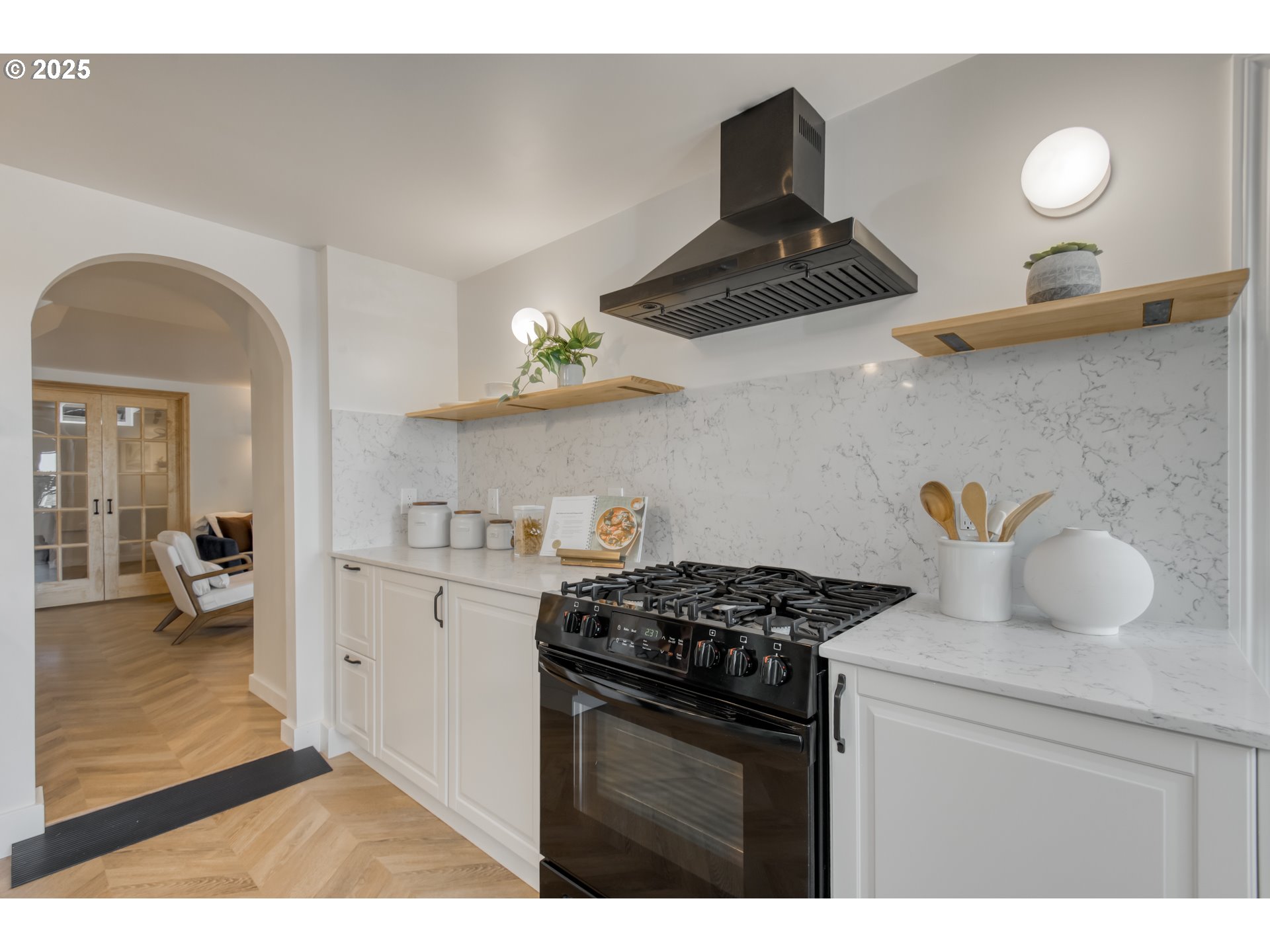 6950 Southeast Ash Street Portland, OR 97215 - Photo 25 of 45 a kitchen with stainless steel appliances granite countertop a stove and a sink