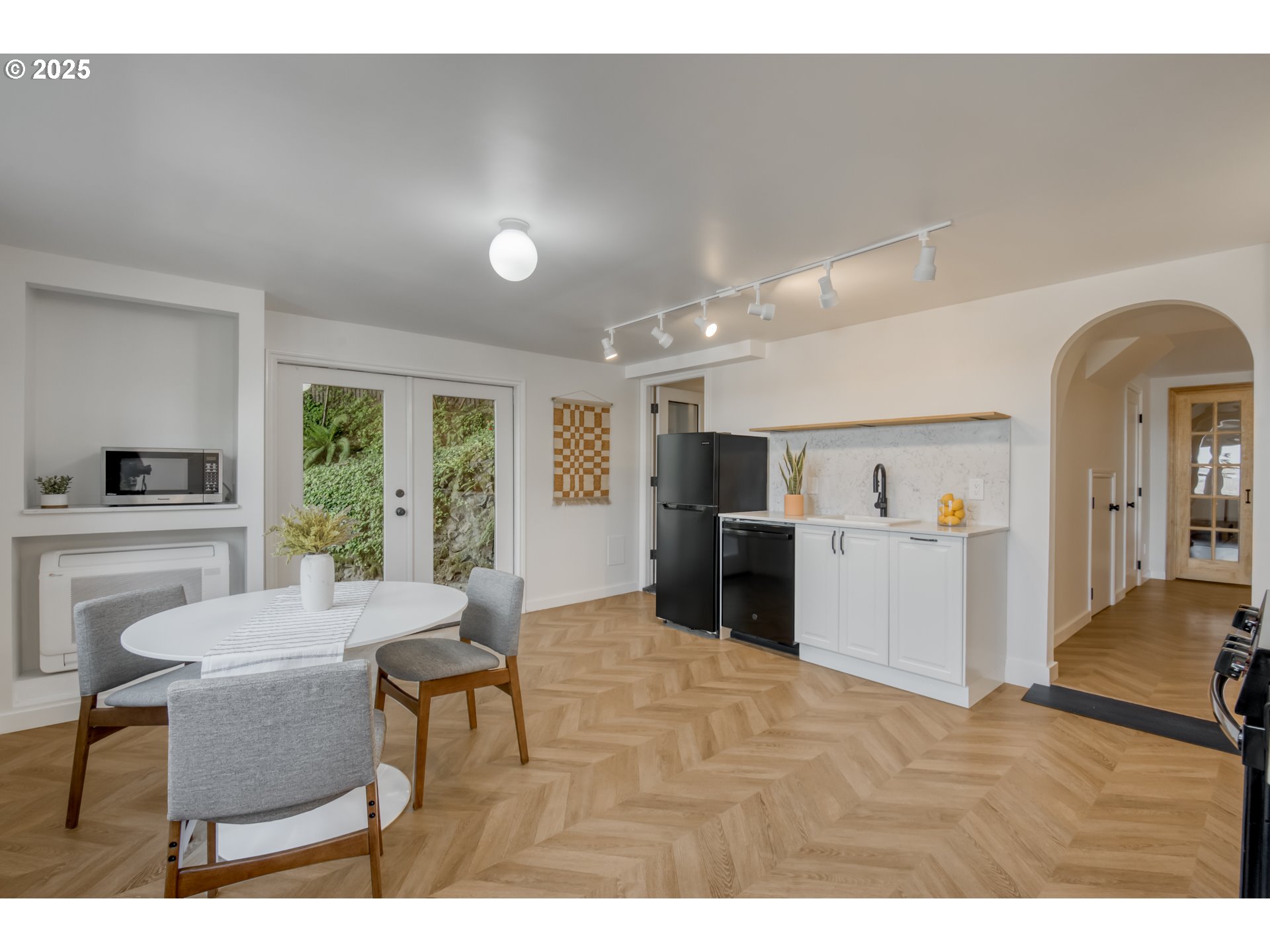 6950 Southeast Ash Street Portland, OR 97215 - Photo 26 of 45 a view of a dining room with furniture window and wooden floor