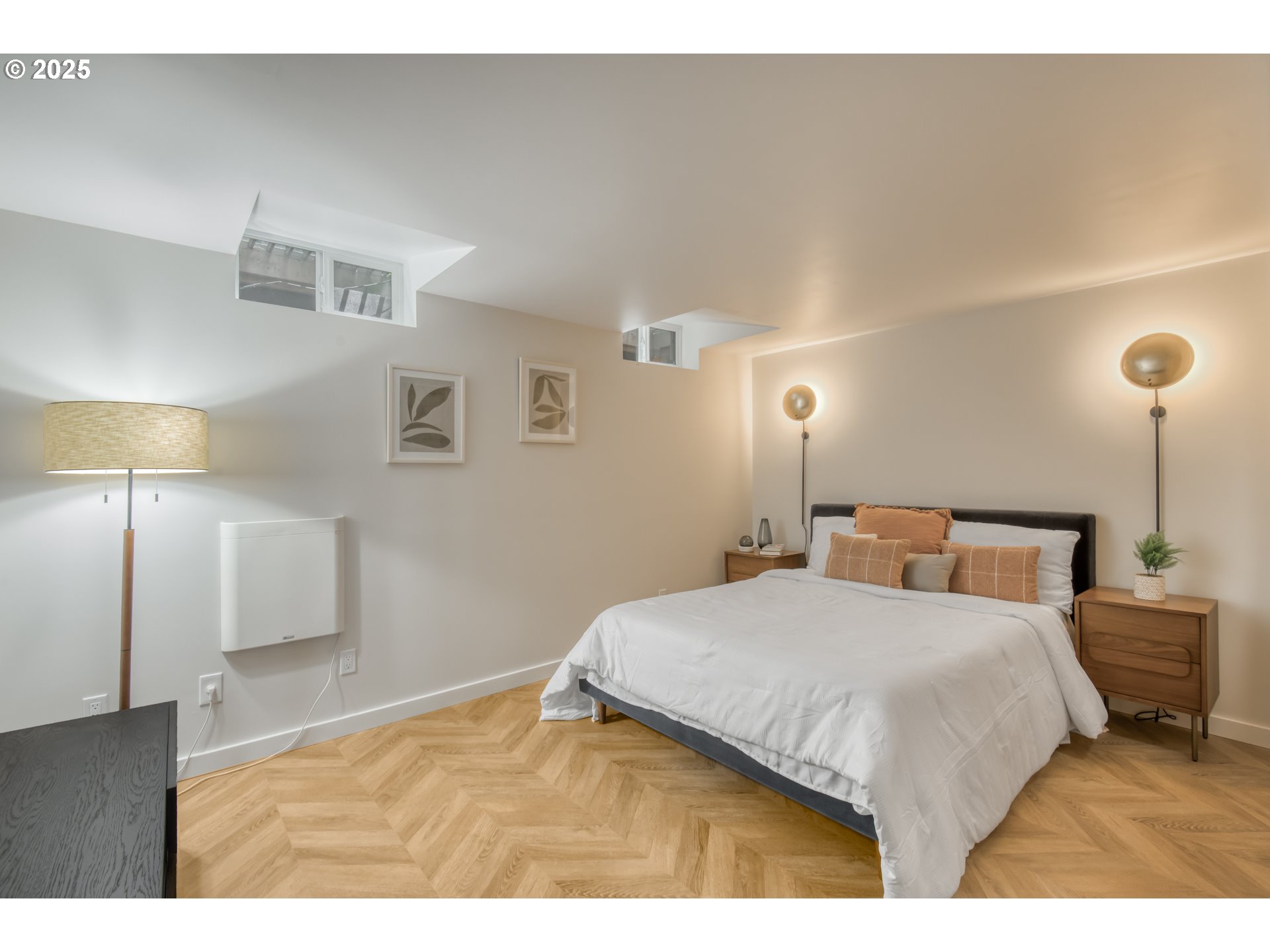 6950 Southeast Ash Street Portland, OR 97215 - Photo 34 of 45 a bedroom with a bed and a night stand