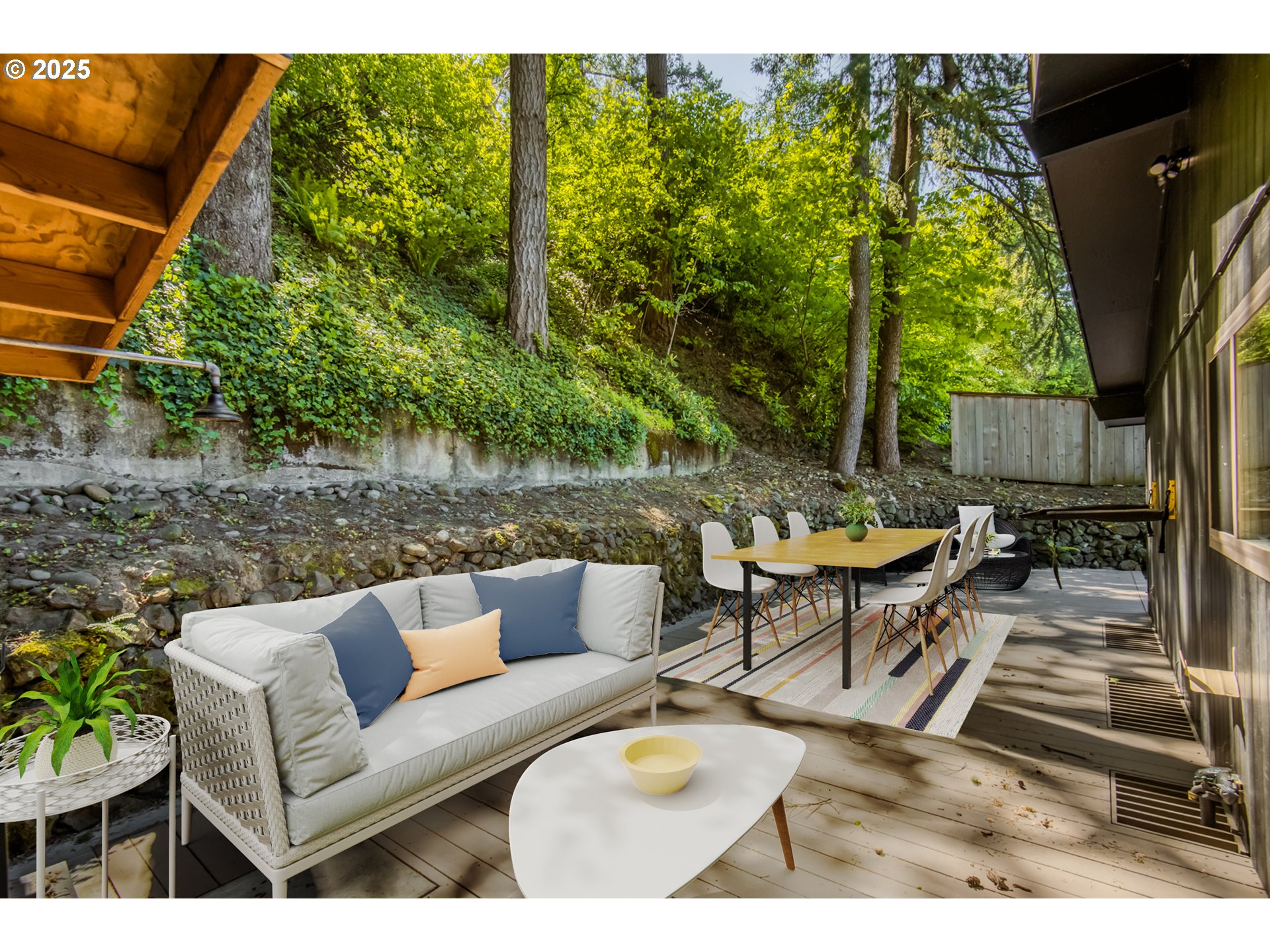 6950 Southeast Ash Street Portland, OR 97215 - Photo 37 of 45 a view of patio with couches table and chairs with plants and trees
