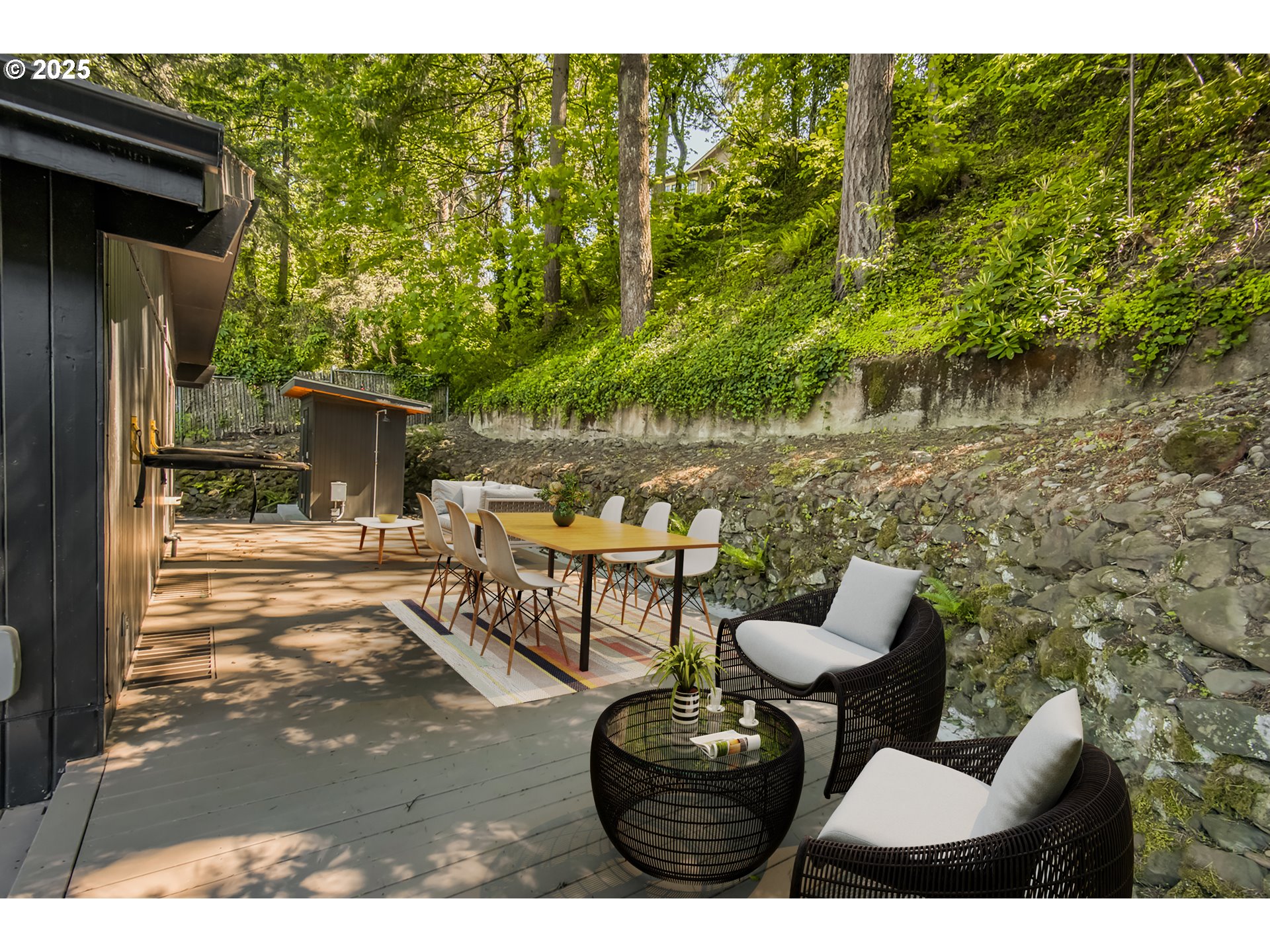 6950 Southeast Ash Street Portland, OR 97215 - Photo 38 of 45 a view of a chairs and table in backyard