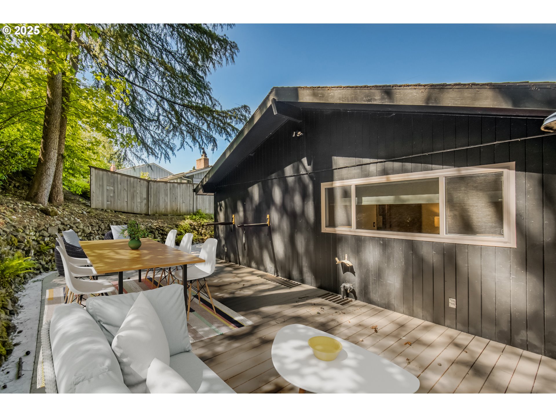 6950 Southeast Ash Street Portland, OR 97215 - Photo 40 of 45 a backyard of a house with yard and outdoor seating