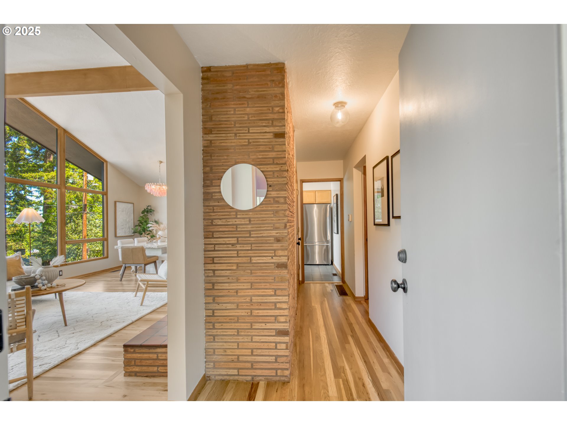 6950 Southeast Ash Street Portland, OR 97215 - Photo 4 of 45 a view of a hallway view with wooden floor and staircase