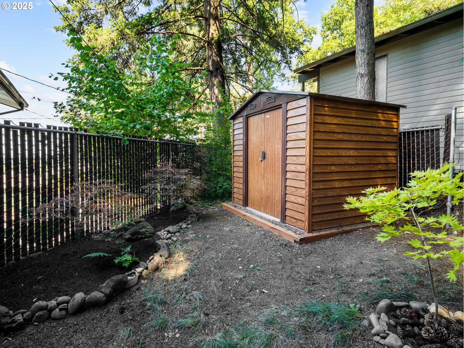 6950 Southeast Ash Street Portland, OR 97215 - Photo 41 of 45 a view of a house with a yard and plants