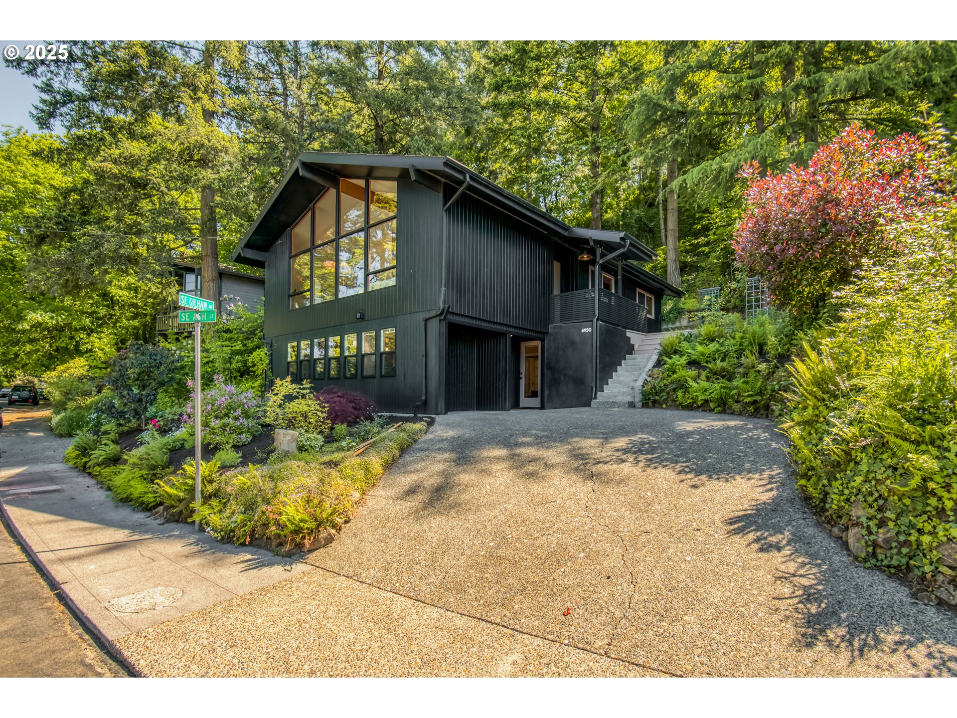6950 Southeast Ash Street Portland, OR 97215 - Photo 42 of 45 a view of a house with a yard