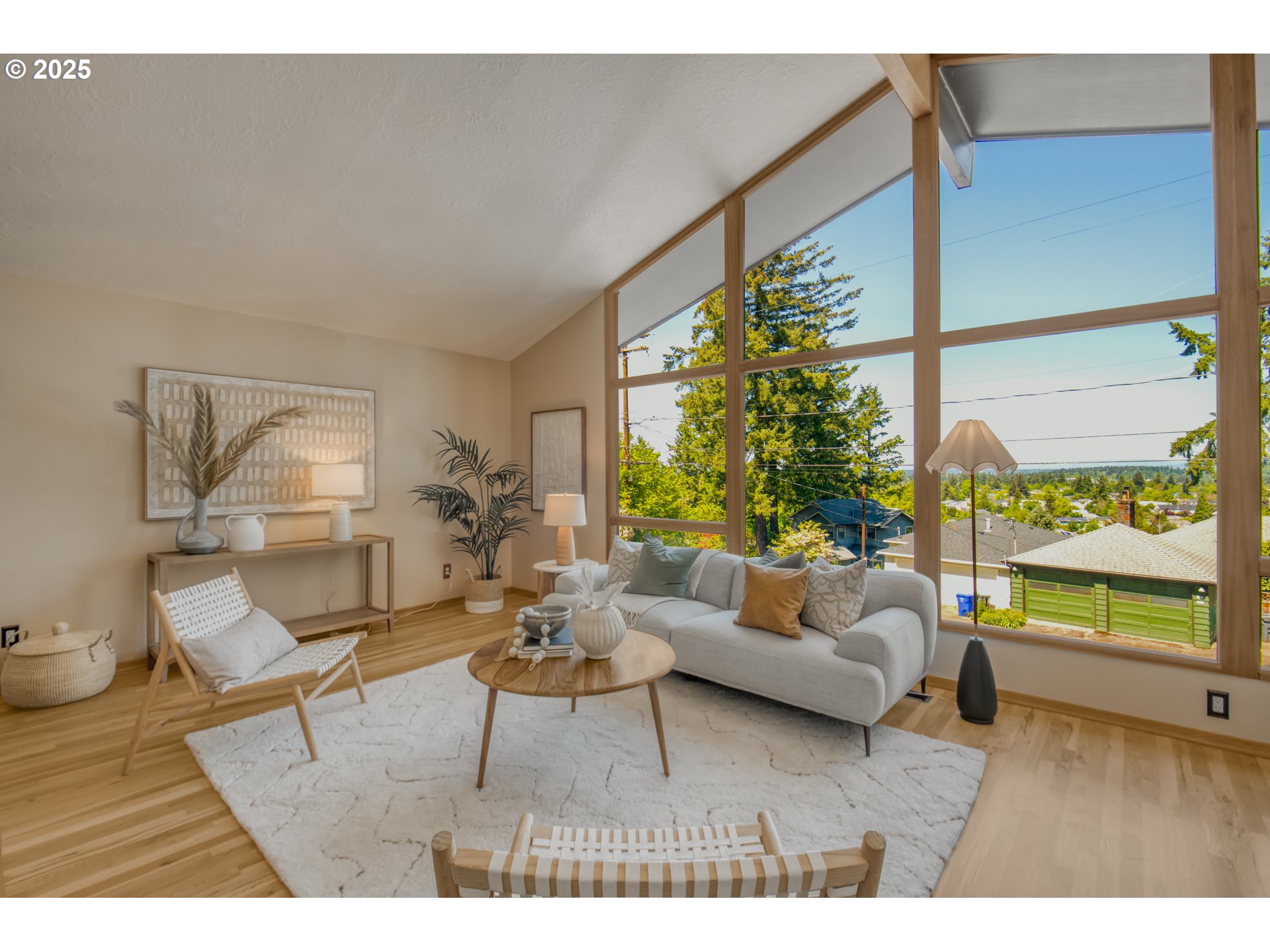 6950 Southeast Ash Street Portland, OR 97215 - Photo 5 of 45 a living room with furniture and a large window