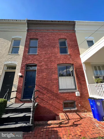 a brick building with a large window