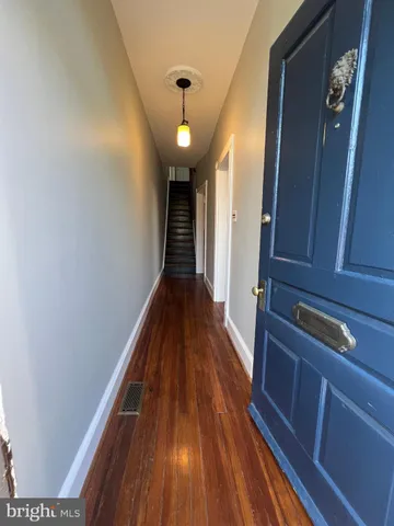 a view of entryway with wooden floor