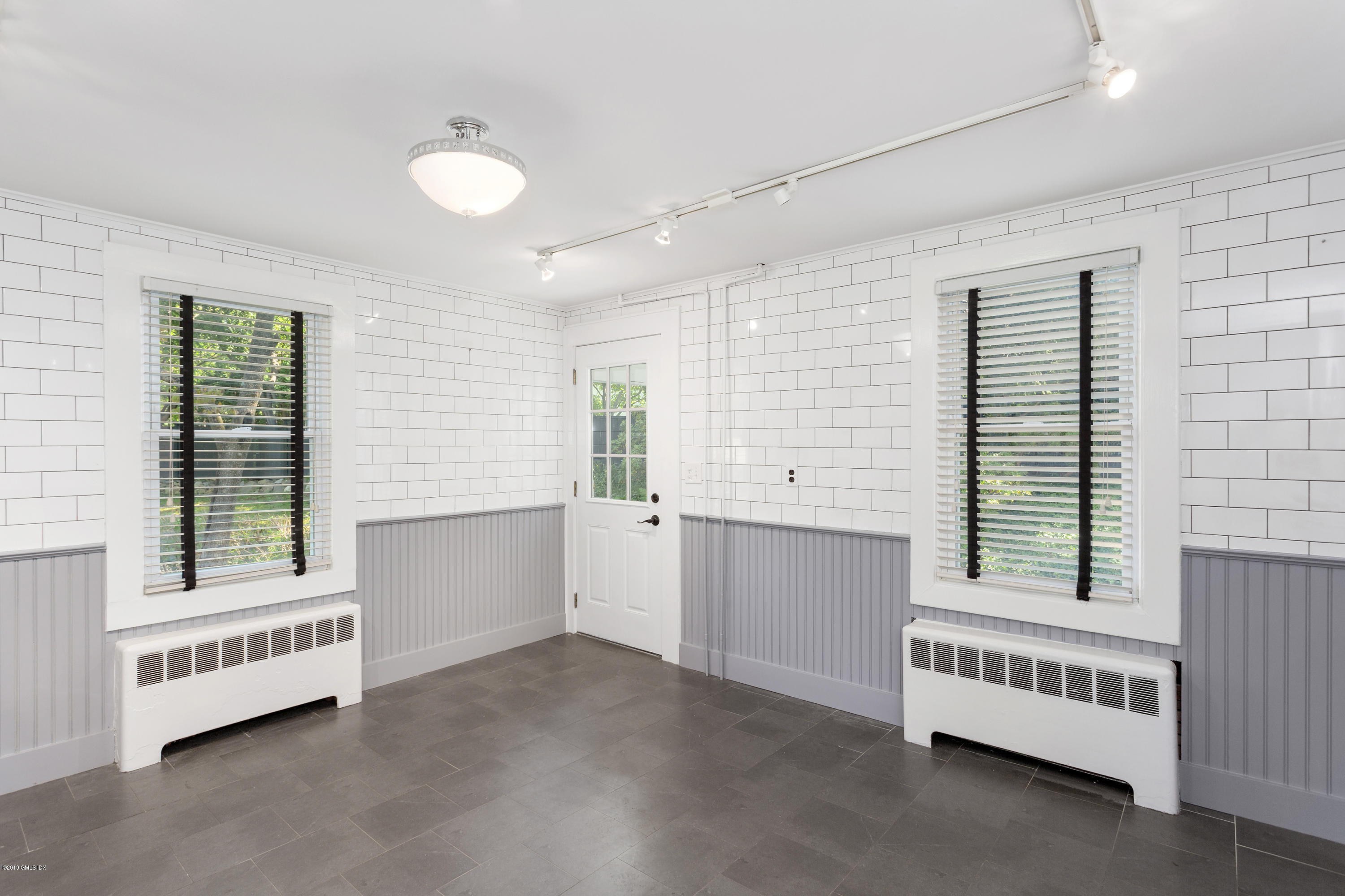 33 Parsonage Road Greenwich, CT 06830 - Photo 3 of 11 an empty room with windows