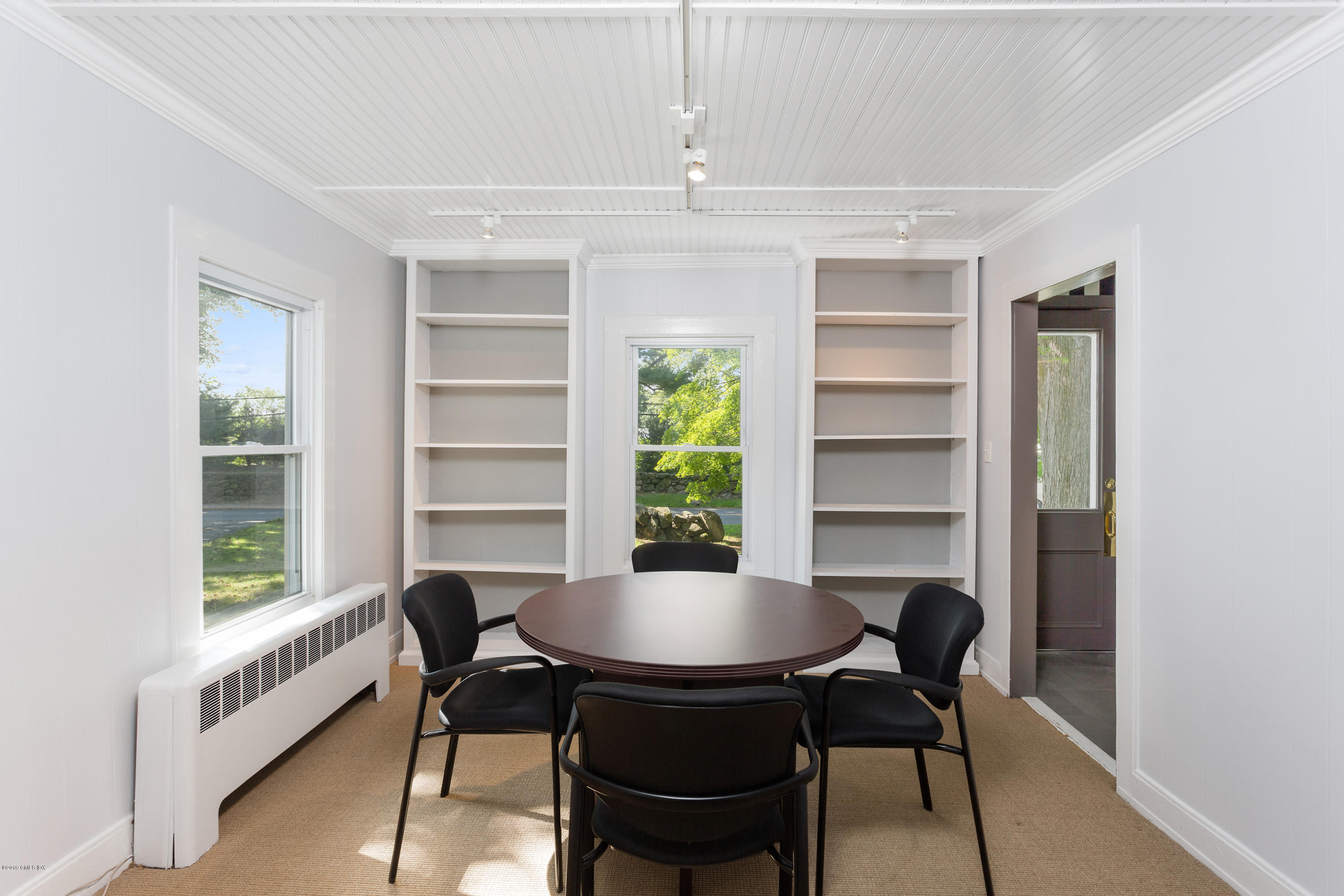 33 Parsonage Road Greenwich, CT 06830 - Photo 5 of 11 a view of a dining room with a table and chairs