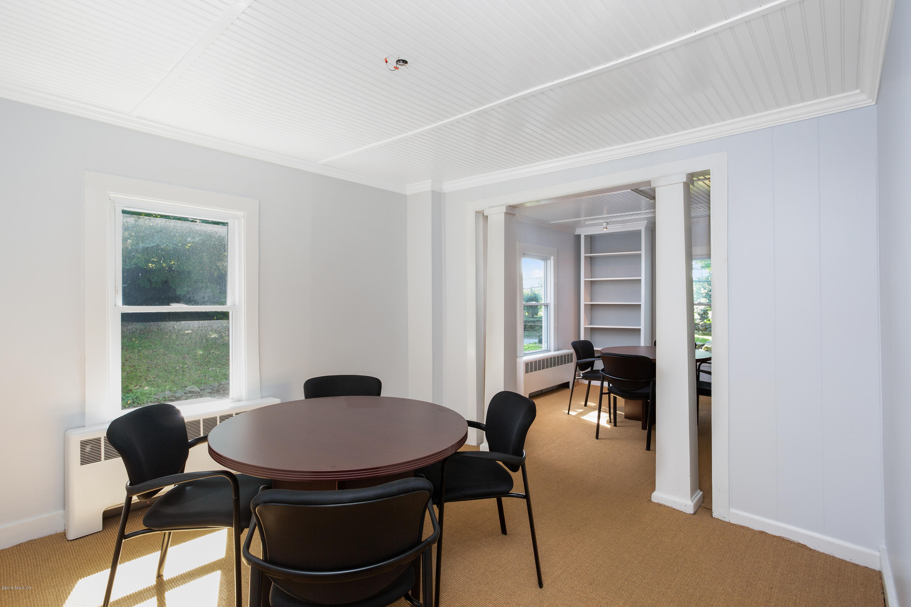 33 Parsonage Road Greenwich, CT 06830 - Photo 6 of 11 a view of a dining room with furniture and a window