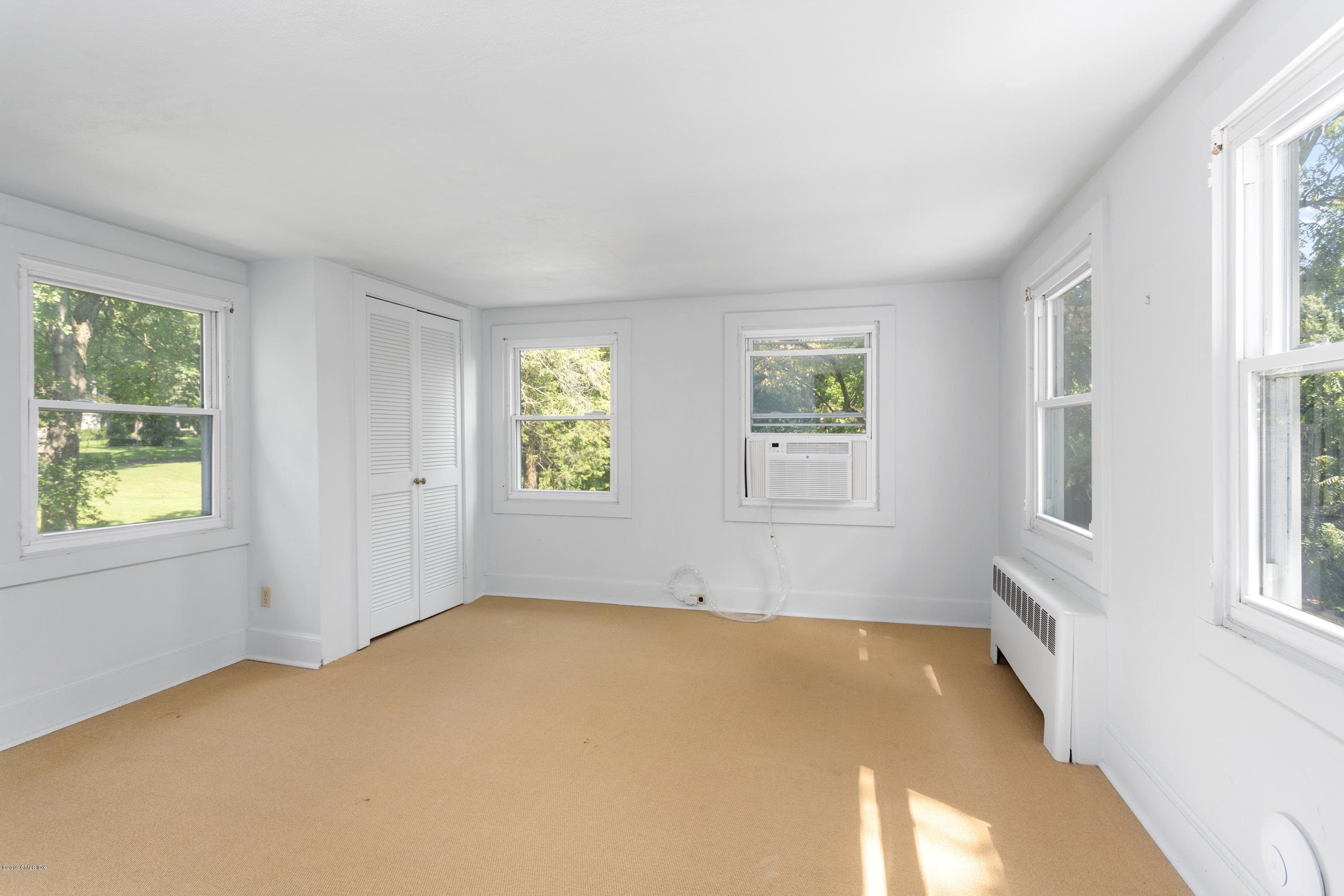 33 Parsonage Road Greenwich, CT 06830 - Photo 7 of 11 an empty room with windows