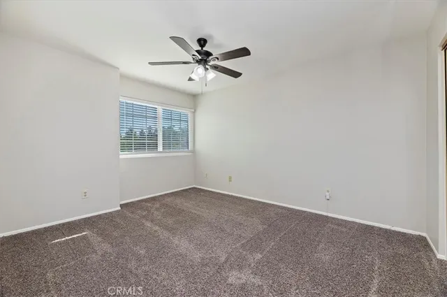 a bathroom with double vanity sink a mirror and a shower