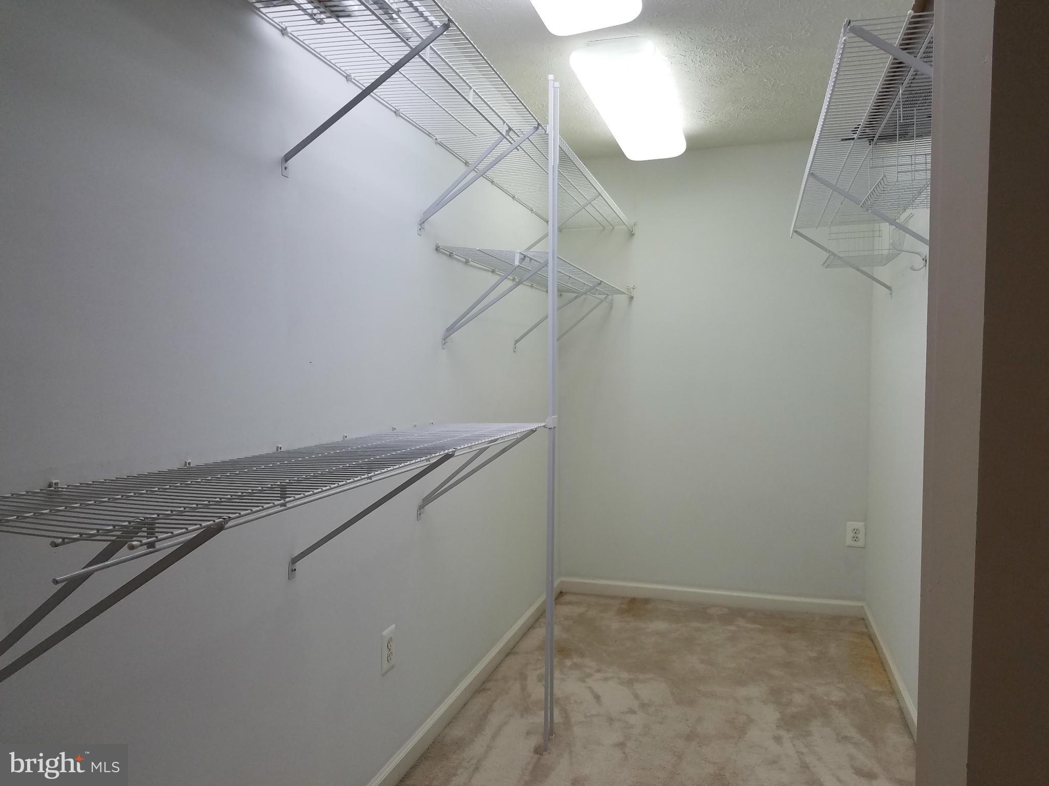 6391 Rutherford Court, Unit B Frederick, MD 21703 - Photo 21 of 25 Storage room behind hall bookcase