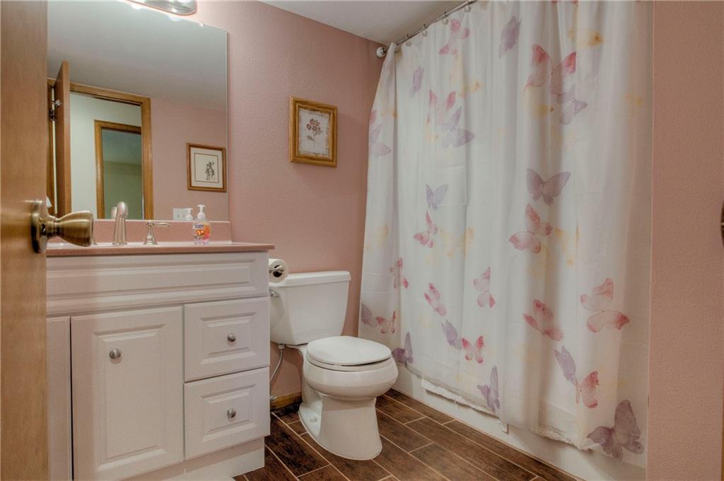 4811 Ryan Gulch Road, Unit 4811 Silverthorne, CO 80498 - Photo 19 of 35 a bathroom with a sink toilet and shower