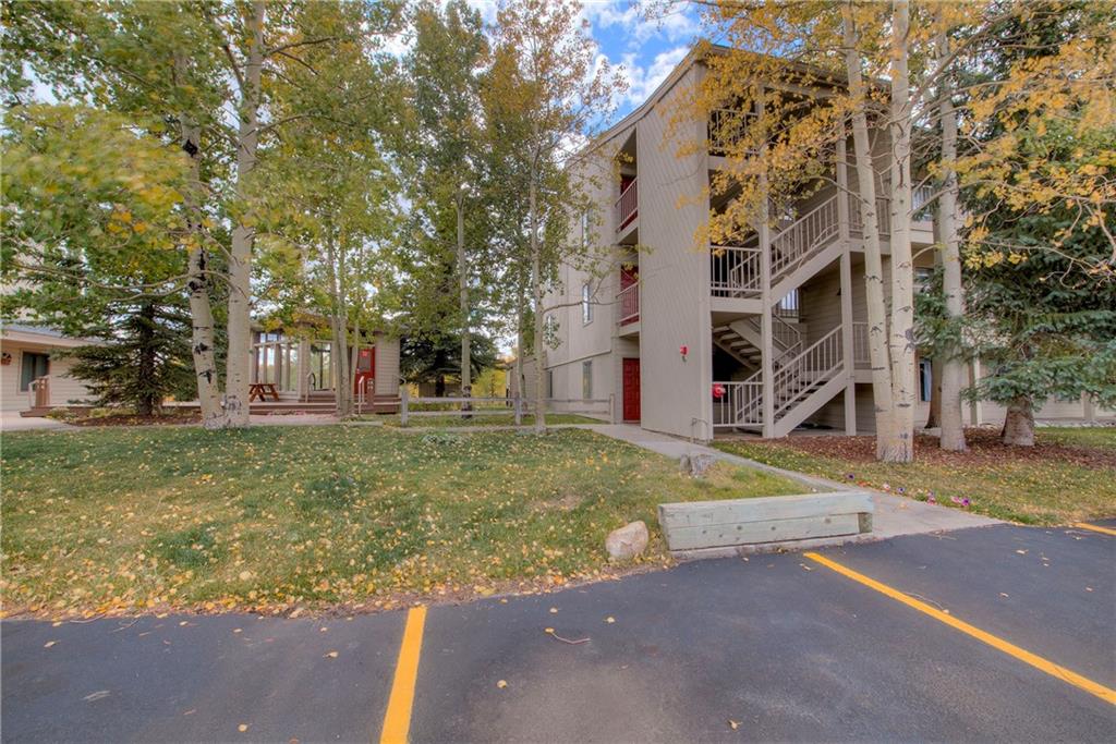 4811 Ryan Gulch Road, Unit 4811 Silverthorne, CO 80498 - Photo 25 of 35 front view of a building with a yard