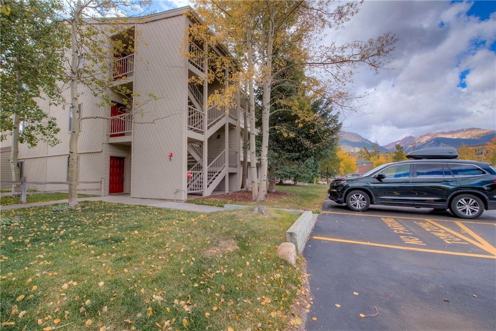 4811 Ryan Gulch Road, Unit 4811 Silverthorne, CO 80498 - Photo 26 of 35 a car parked in front of a house