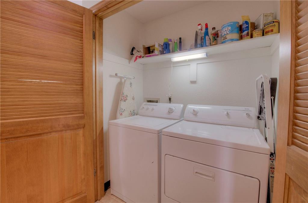 4811 Ryan Gulch Road, Unit 4811 Silverthorne, CO 80498 - Photo 27 of 35 a utility room with dryer and washer